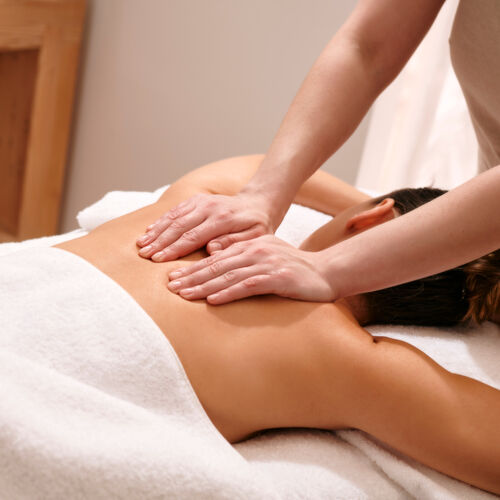 endota therapist massaging woman's back