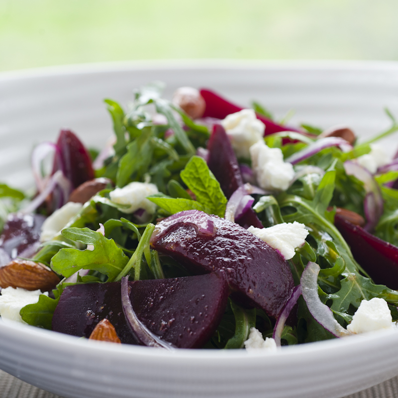 Beetroot salad with onion, rocket, almonds and cheese